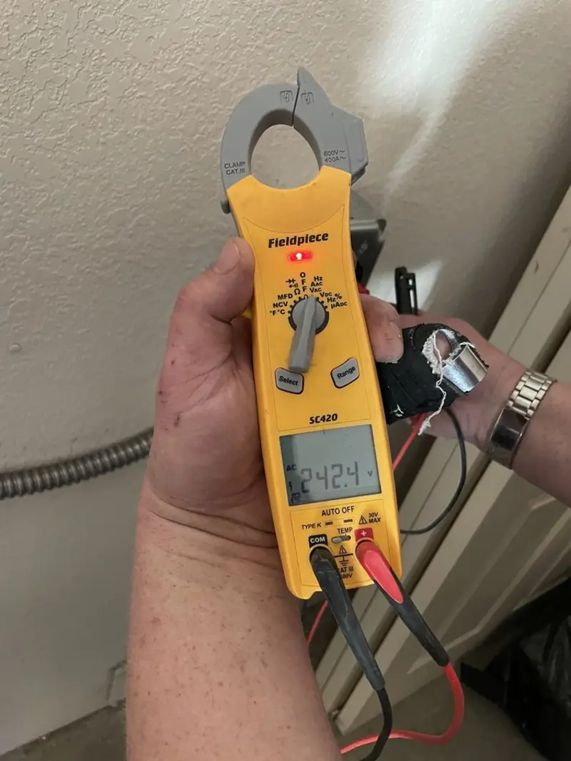 Voltage testing with clamp meter during Generator Installation in Ave Maria